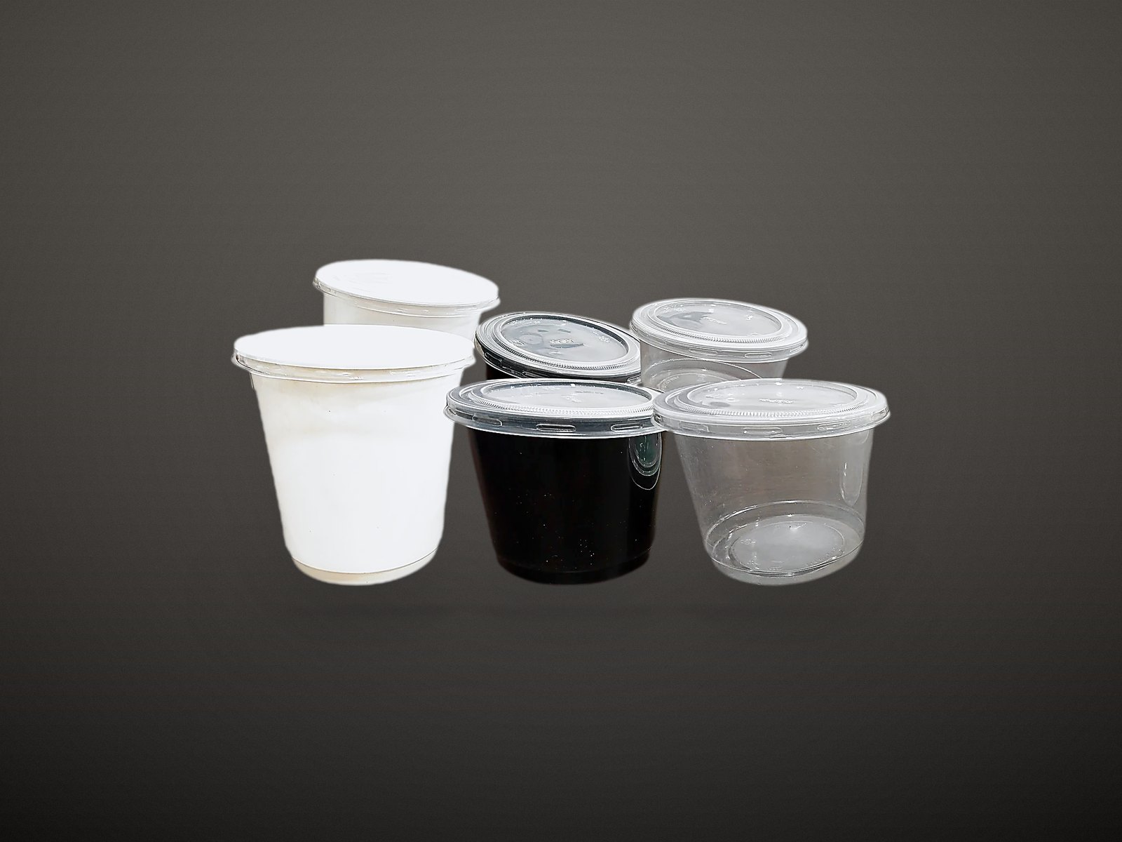 Six food containers in white, black and clear, stacked in a pyramid