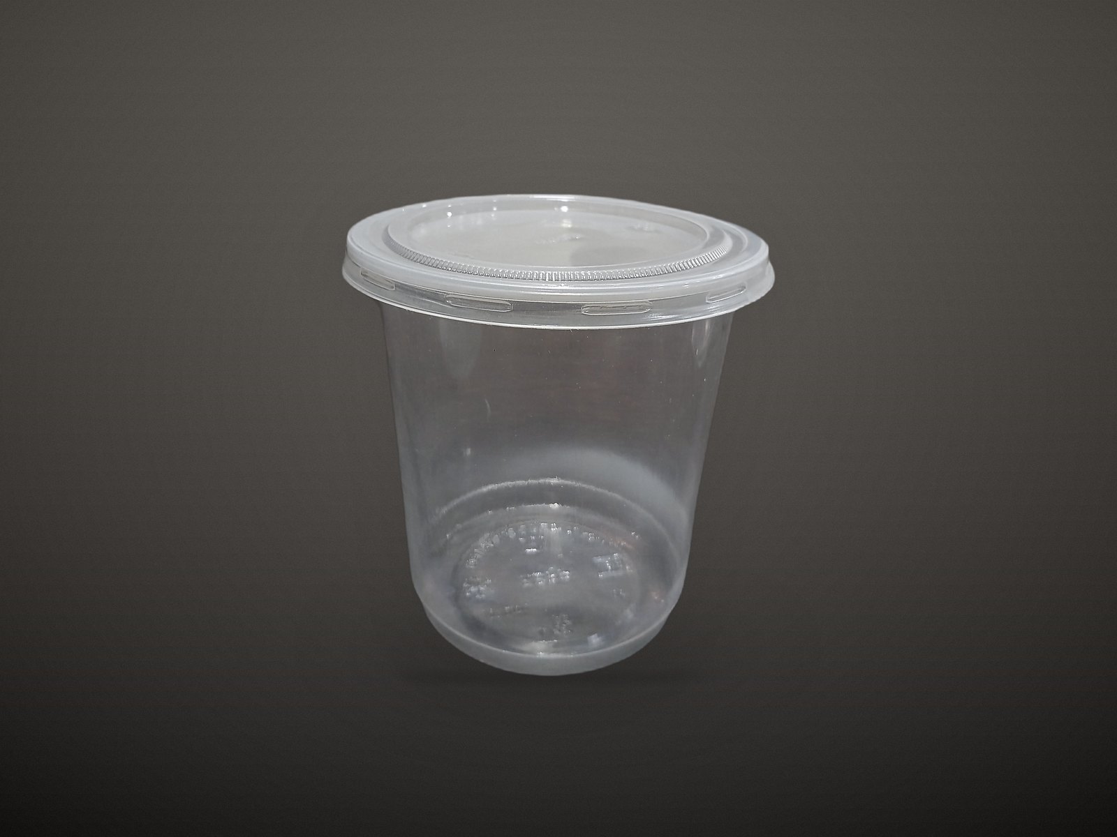 Clear plastic cup with a snap-on lid
