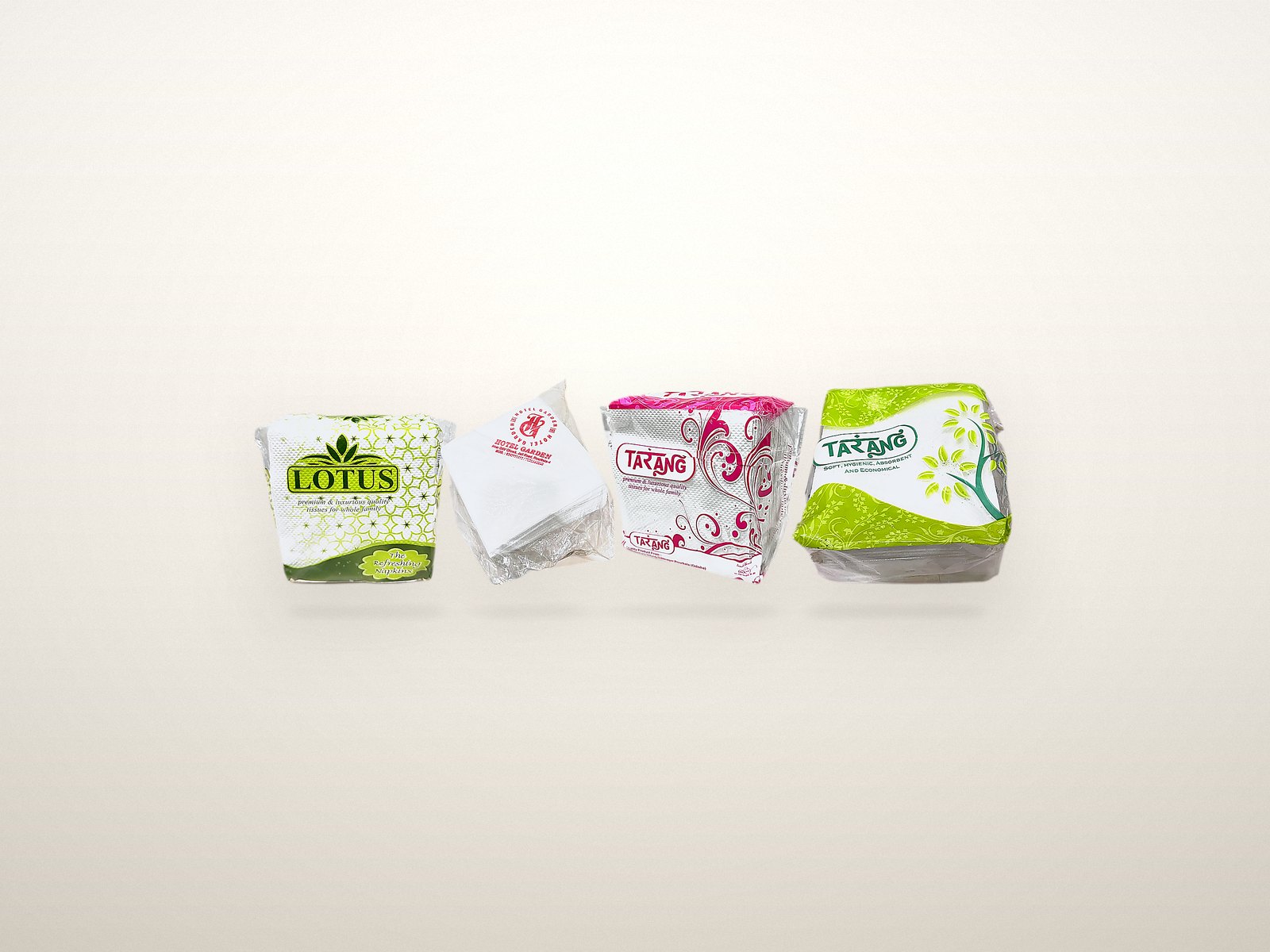 Lotus, Tarang magenta and Tarang green napkin packs grouped together